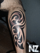 black_ink_tribal_leg_tattoo.jpg