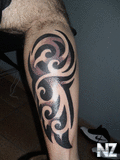 black_ink_tribal_leg_tattoo.jpg